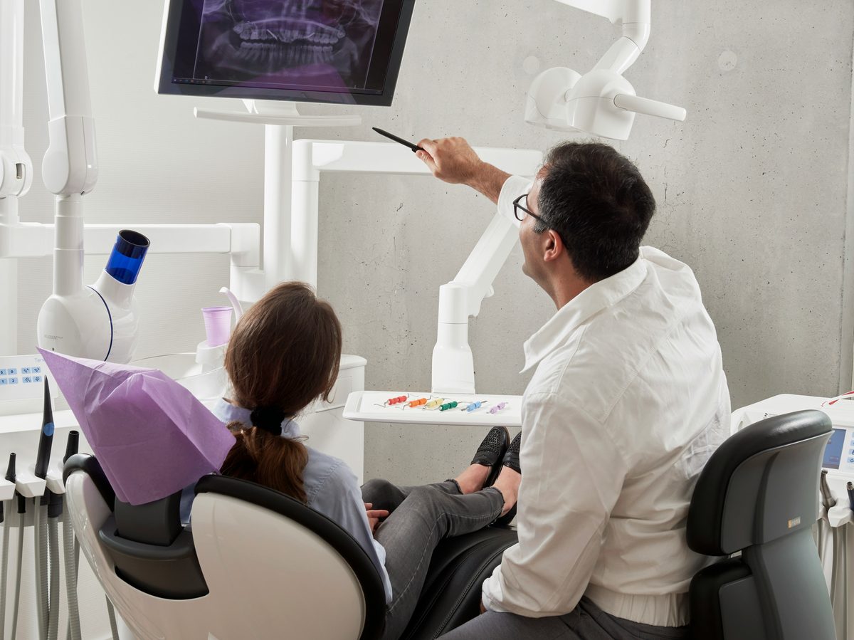 Dentist consulting with a patient in a calm setting