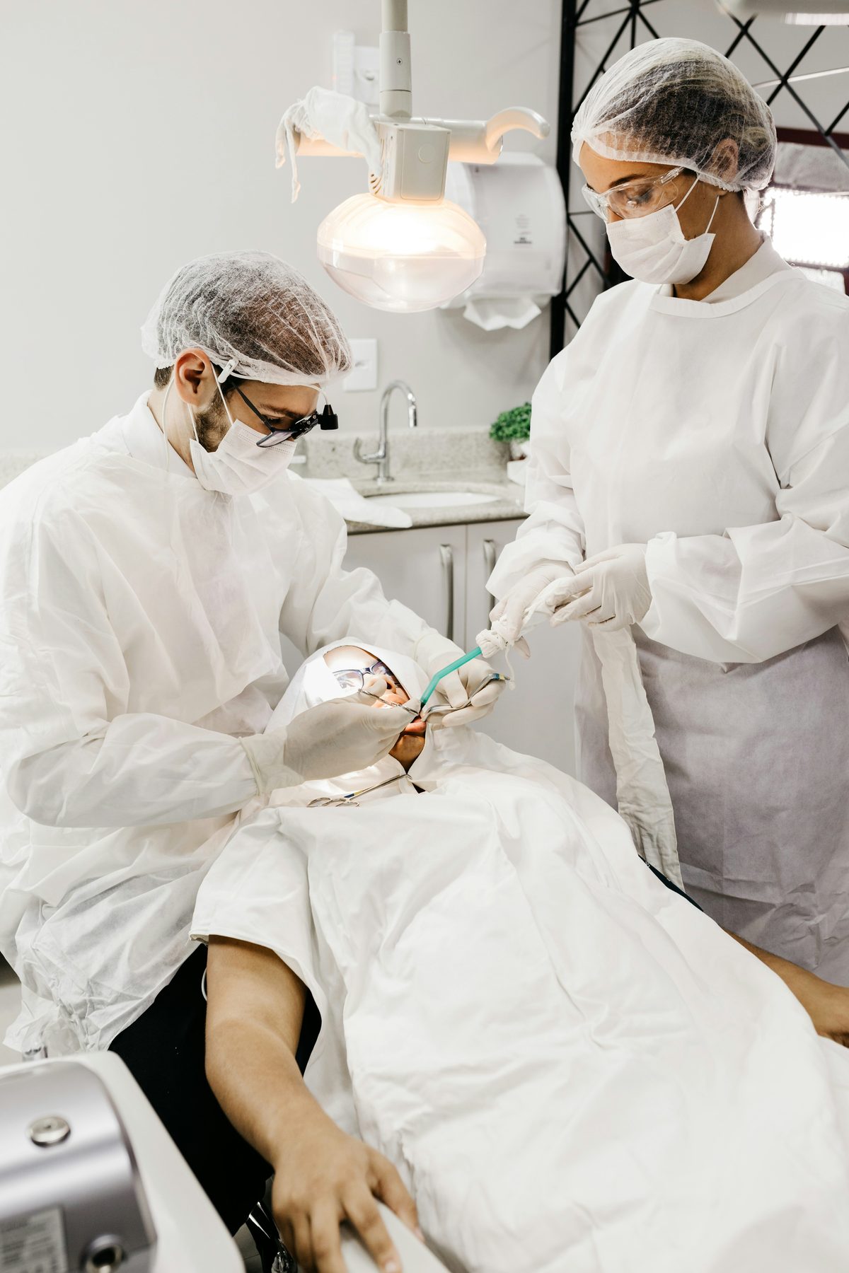 Dentist providing gentle clinical care